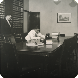 Associates working in the Proskauer library, circa 1950s